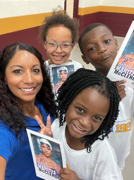 Maritza McClendon with swim1922 children